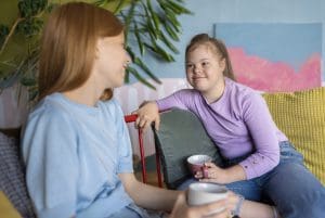 medium shot smiley girls chatting indoors medium shot smiley girls chatting indoors