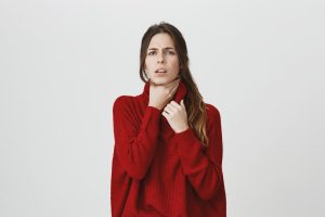 woman feel sick touch neck have sore throat woman feel sick touch neck have sore throat